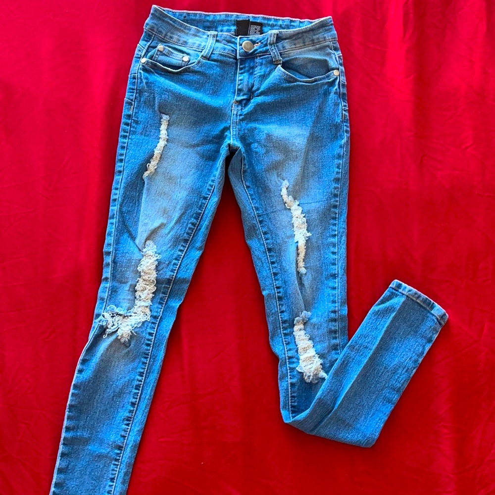 Distressed denim jeans